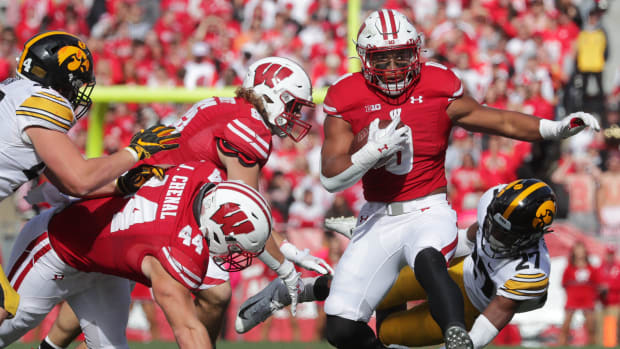 Wisconsin running back Braelon Allen breaking a tackle against Iowa.